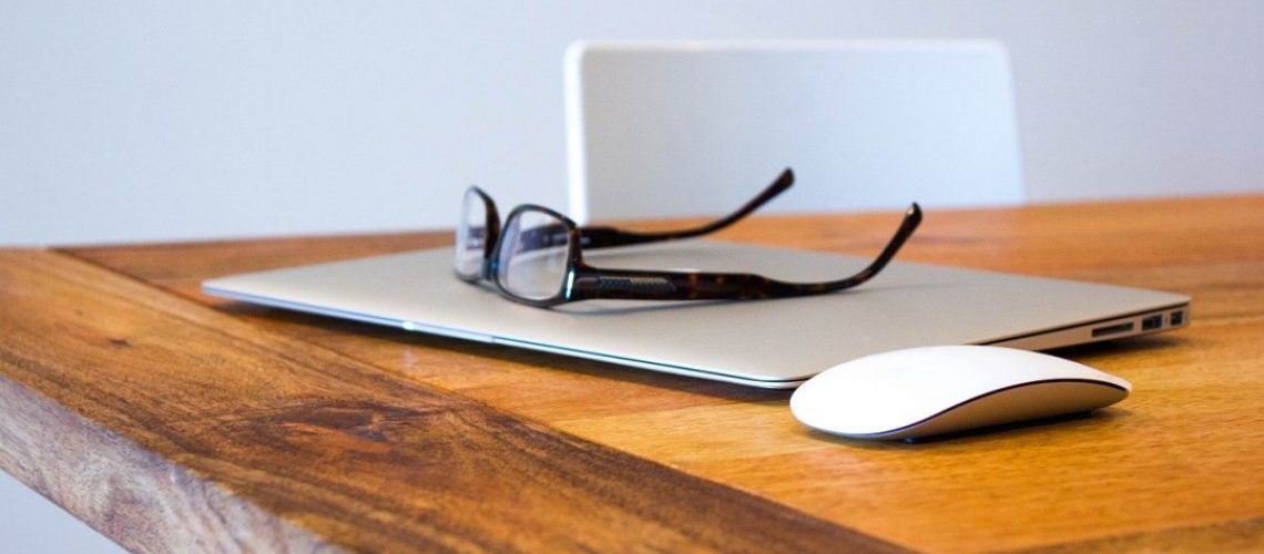 space-for-grwth-networking-cbkl-services-macbook-and-mouse-on-table-with-reading-glasses-1080x675